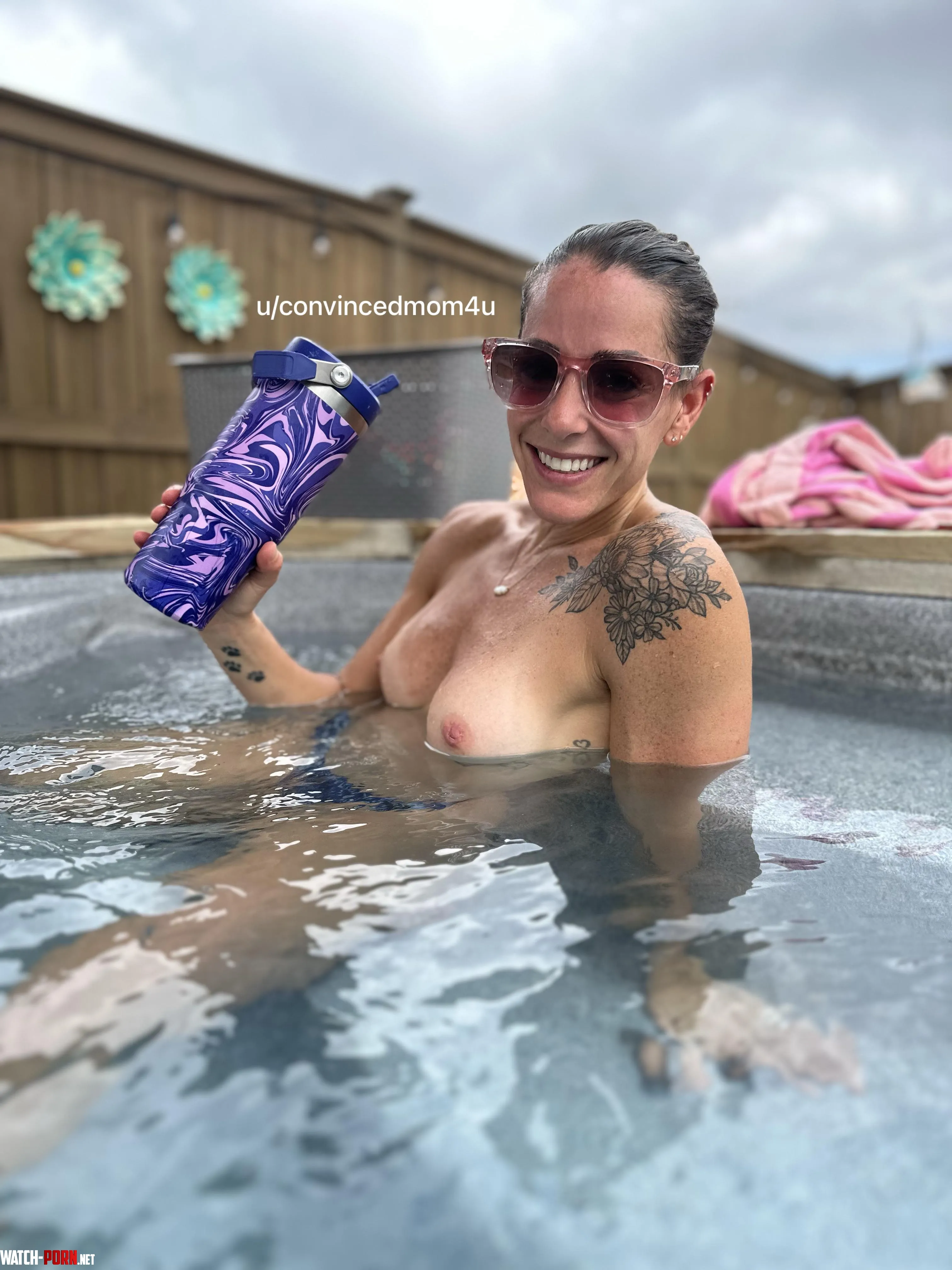 definitely older than i look hereholding a purple drink pink sunglasses tattoos oh and topless in a thong in hot tub where neighbors can def see  by convincedmom4u