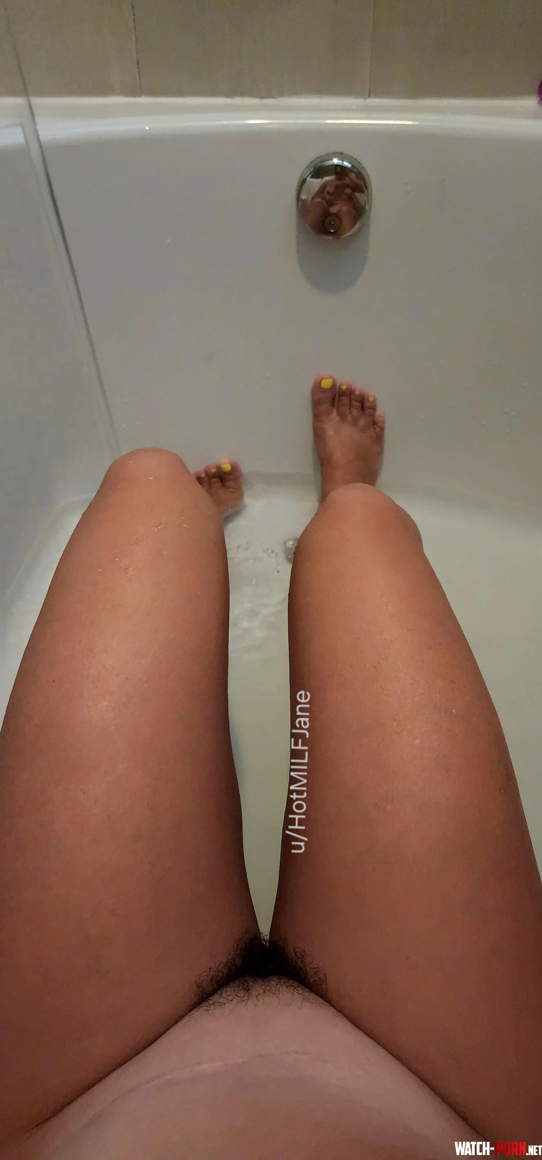 My view of my thick dark bush in the tub Its so long amp soft now by HotMILFJane