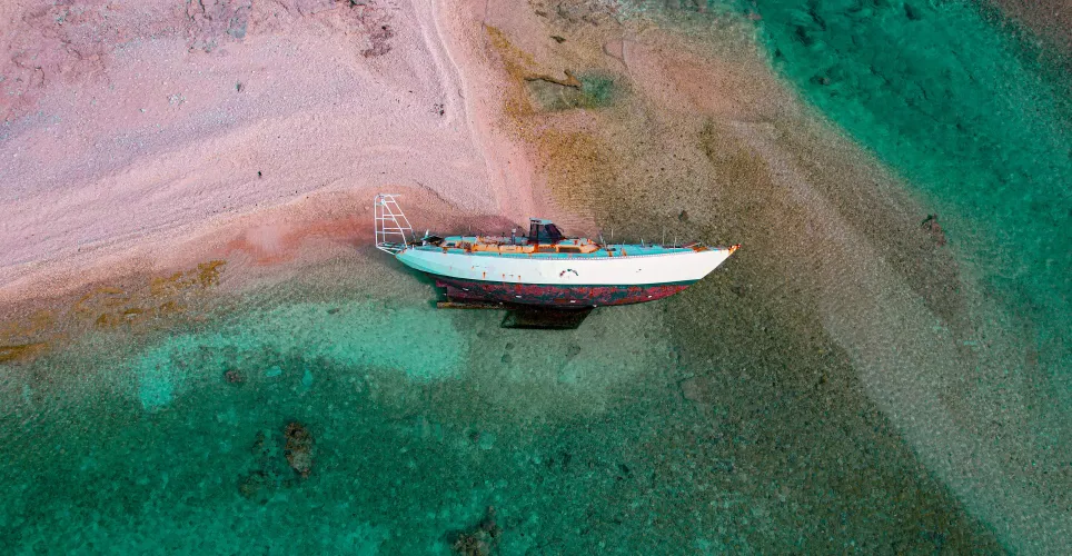 Thumbnail Capturing Serenity: Abandoned Sail Boat on the Beach by Chnyief