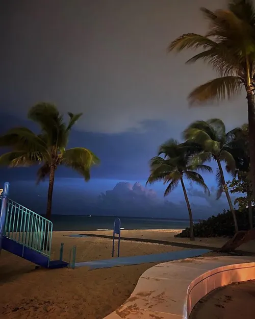 Thumbnail Distant Clouds: A Serene Beachscape by colapepsikinnie