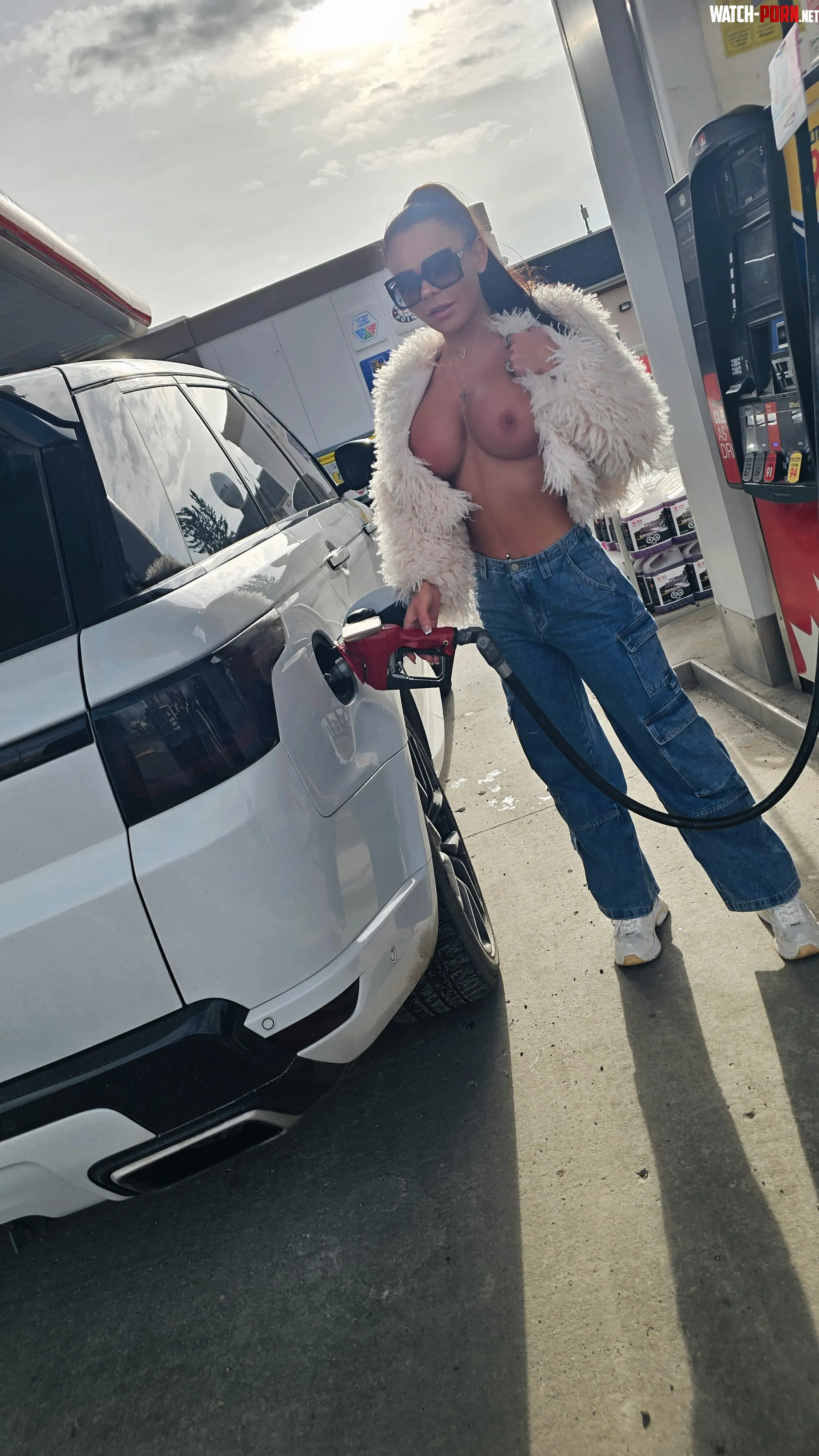 Just teasing my husband and his friends  pumping the car full by HisExoticVixen